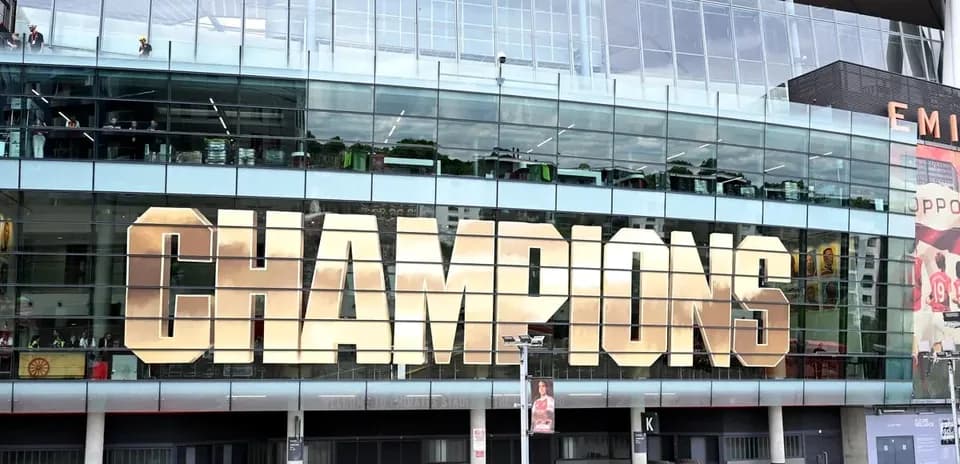 Exterior of stadium displaying 'CHAMPIONS' sign