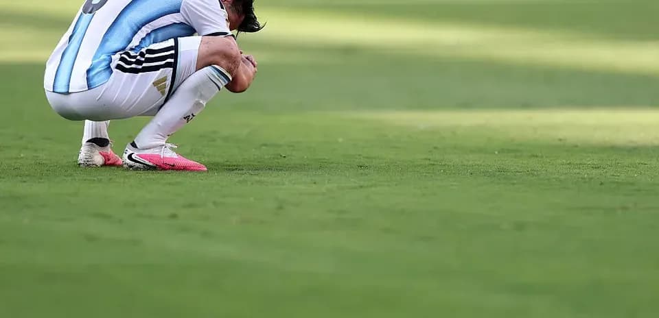Player kneeling on pitch during match