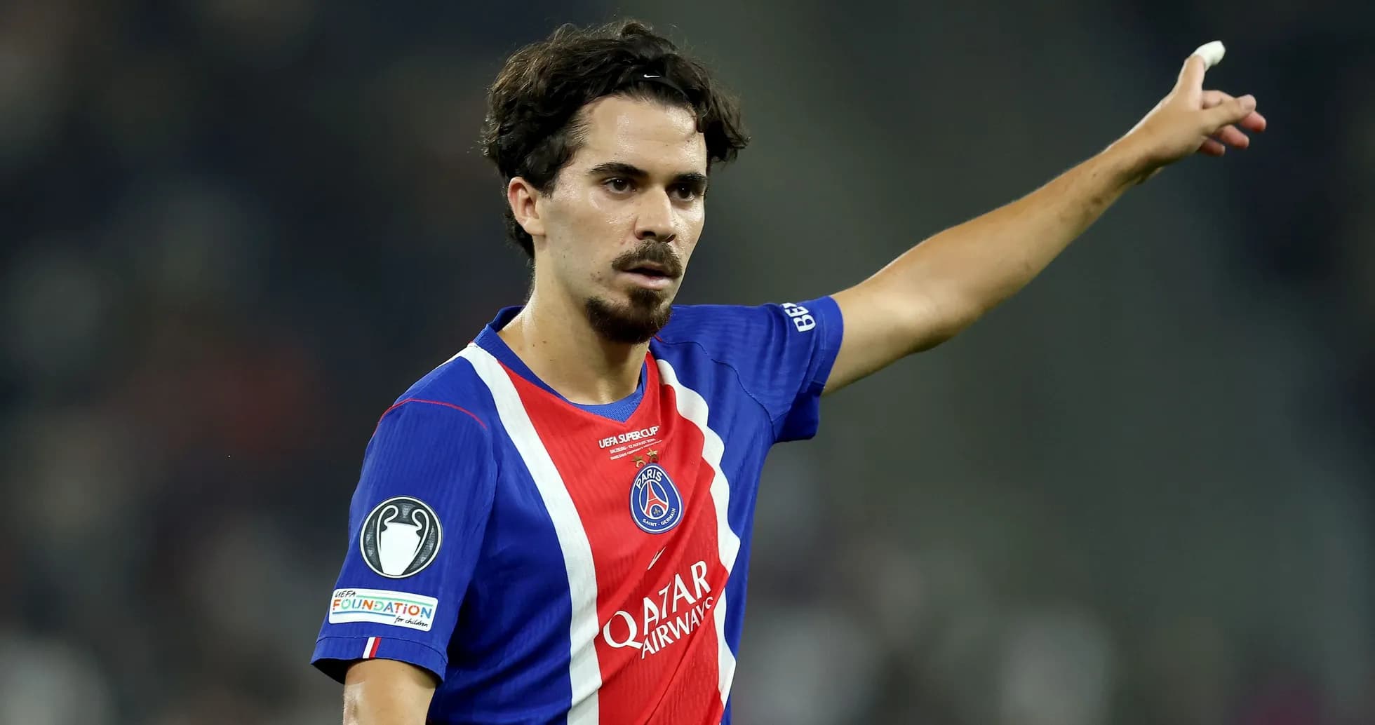 Player gesturing during match in PSG uniform