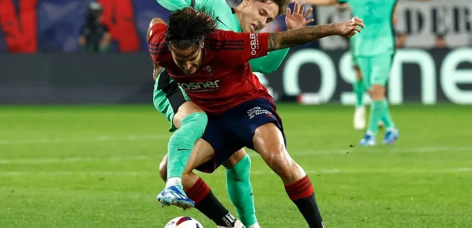 Osasuna player tackled by Atletico Madrid goalkeeper