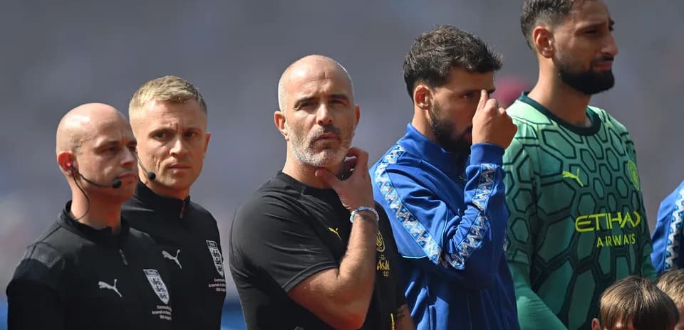 Coaches and players lined up before the match
