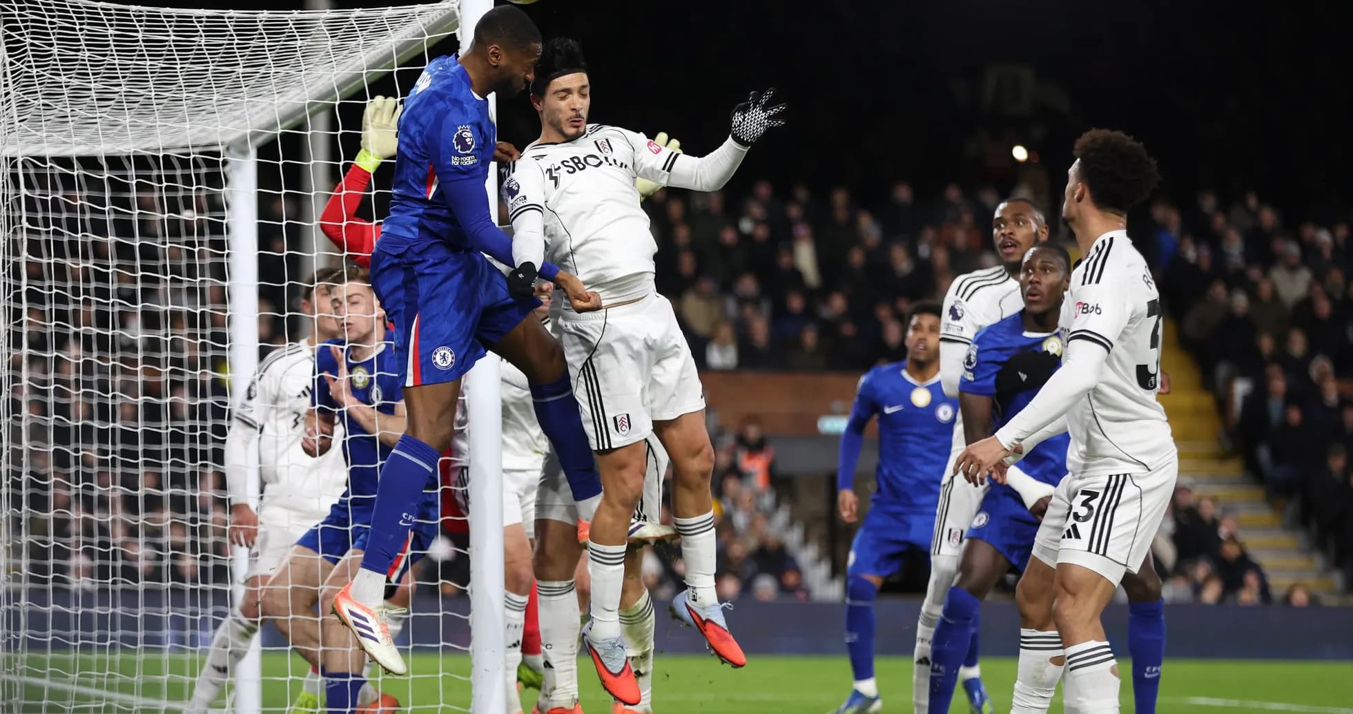 Chelsea player heading the ball during match