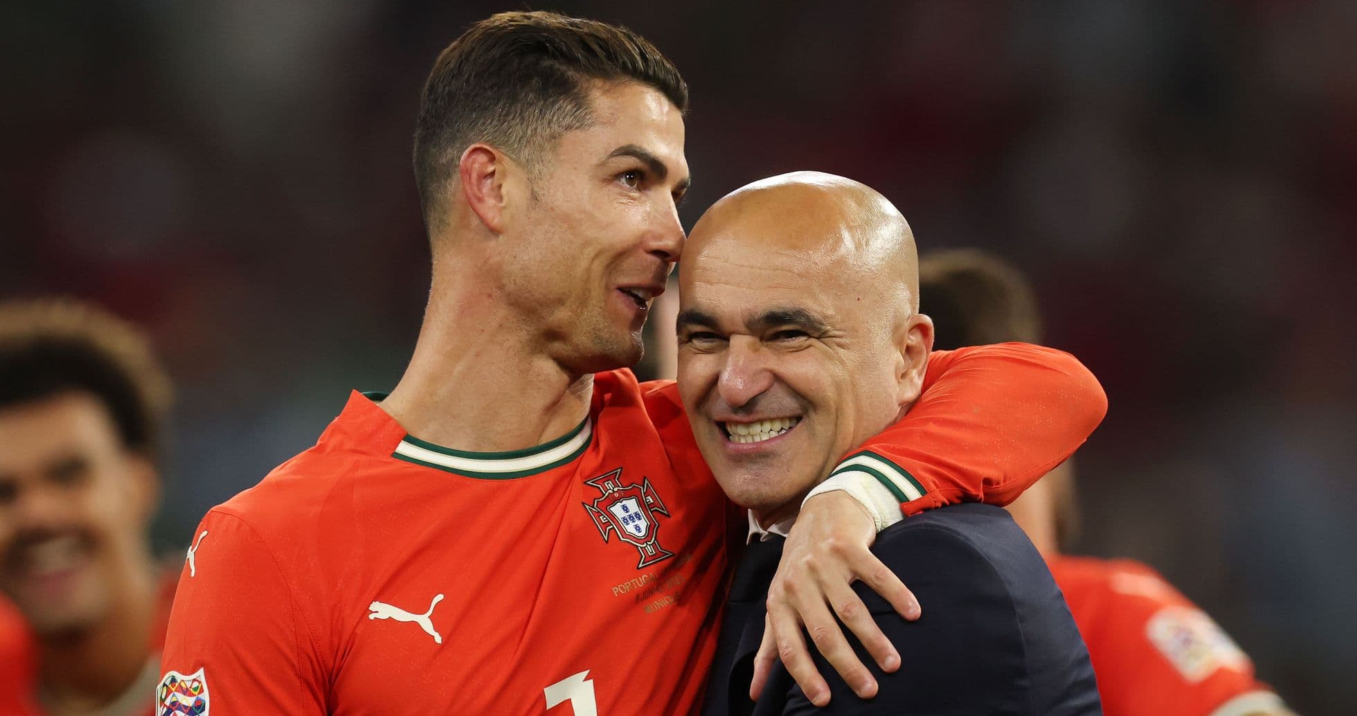 Cristiano Ronaldo and coach celebrating a victory