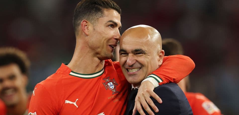 Cristiano Ronaldo and coach celebrating a victory