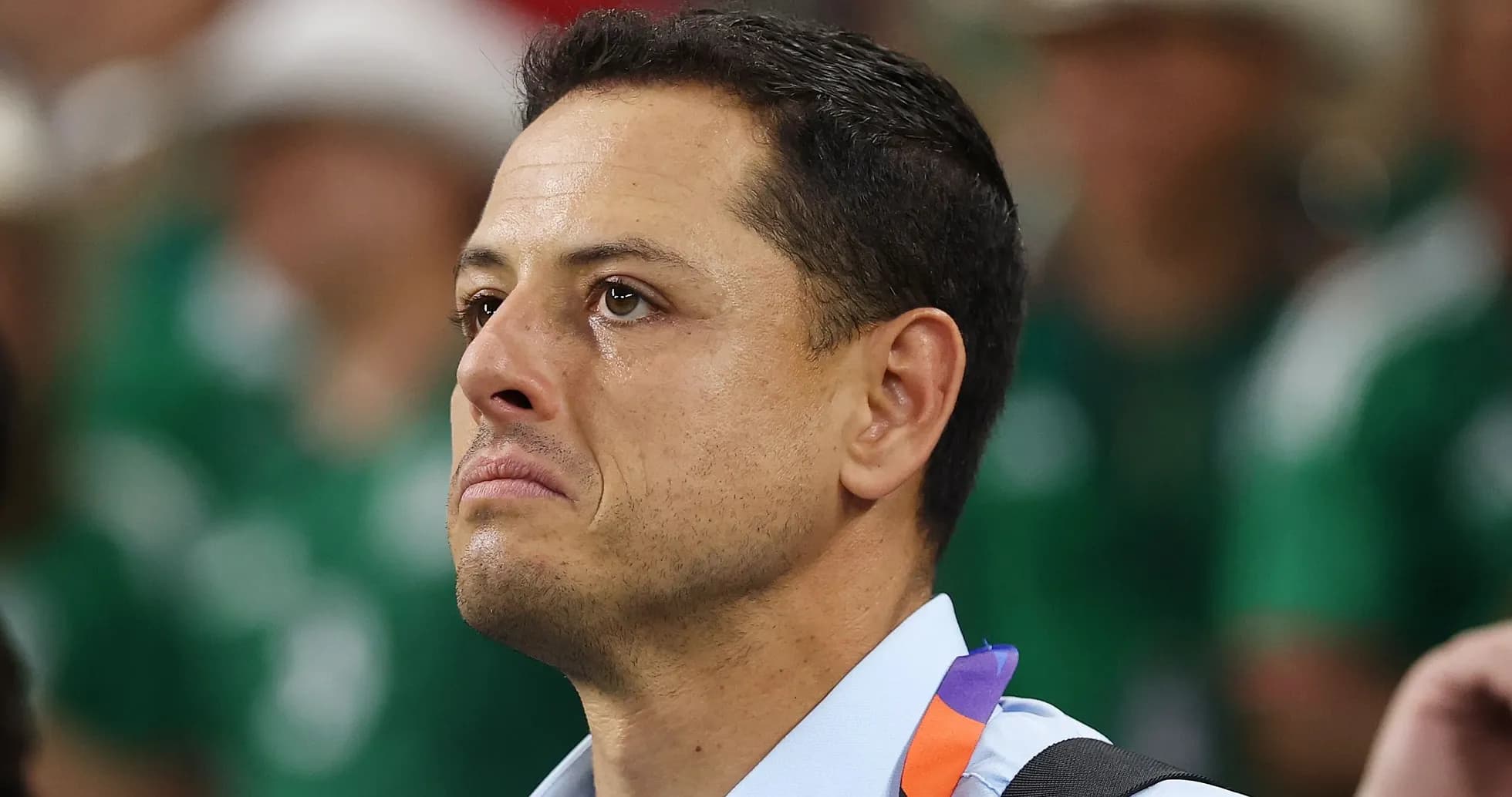 Man with tearful expression at a sporting event