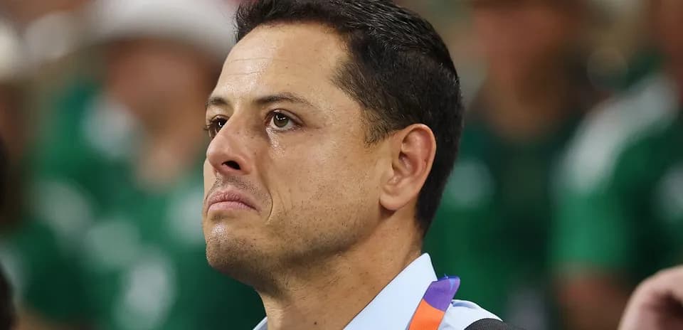 Man with tearful expression at a sporting event