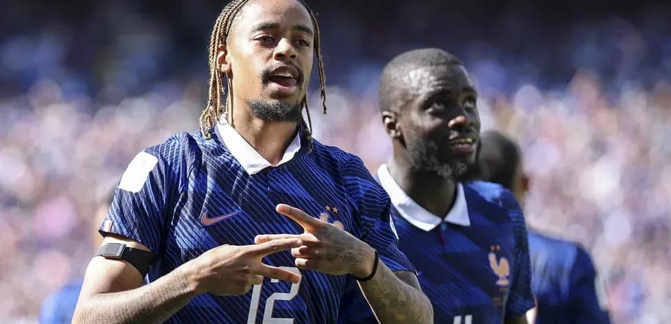 Two French players celebrating during a match