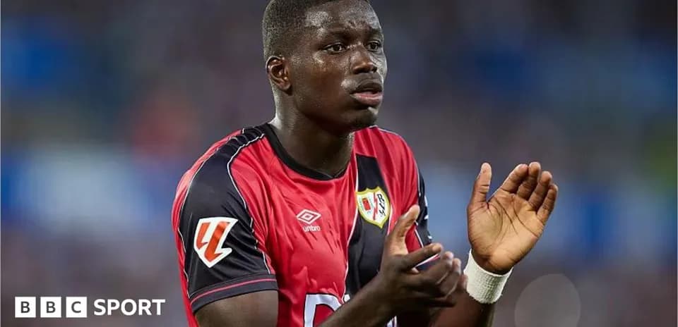 Player in red jersey gesturing during a match