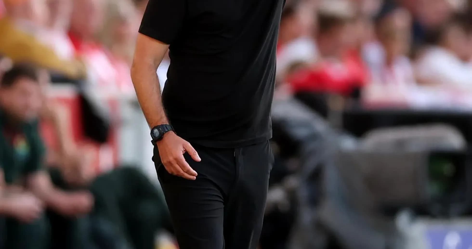 Coach giving instructions during a football match