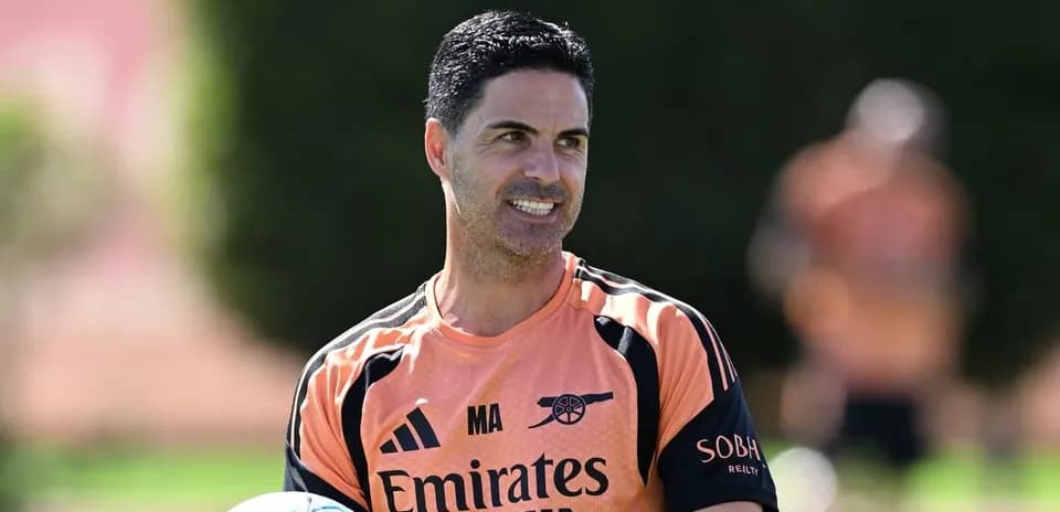 Coach holding a ball during training session
