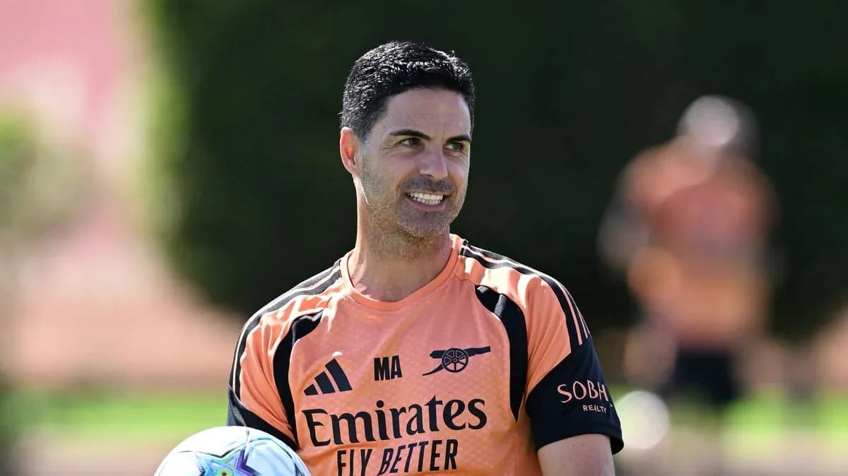 Coach holding a ball during training session