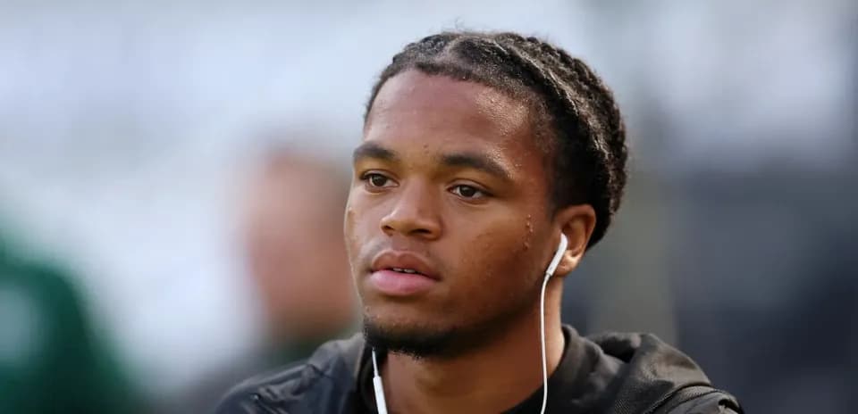 Player wearing earbuds before the match