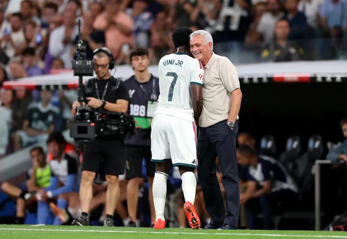 Vinicius Jr. and coach interacting on the sidelines
