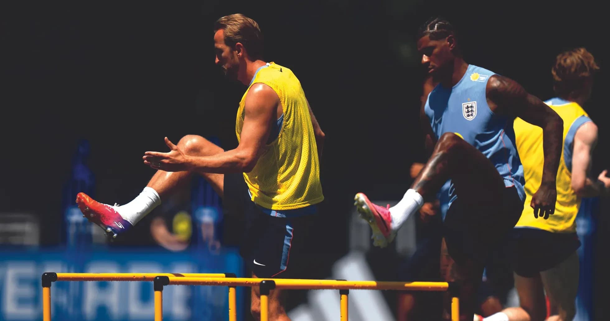 Players training over hurdles during practice session
