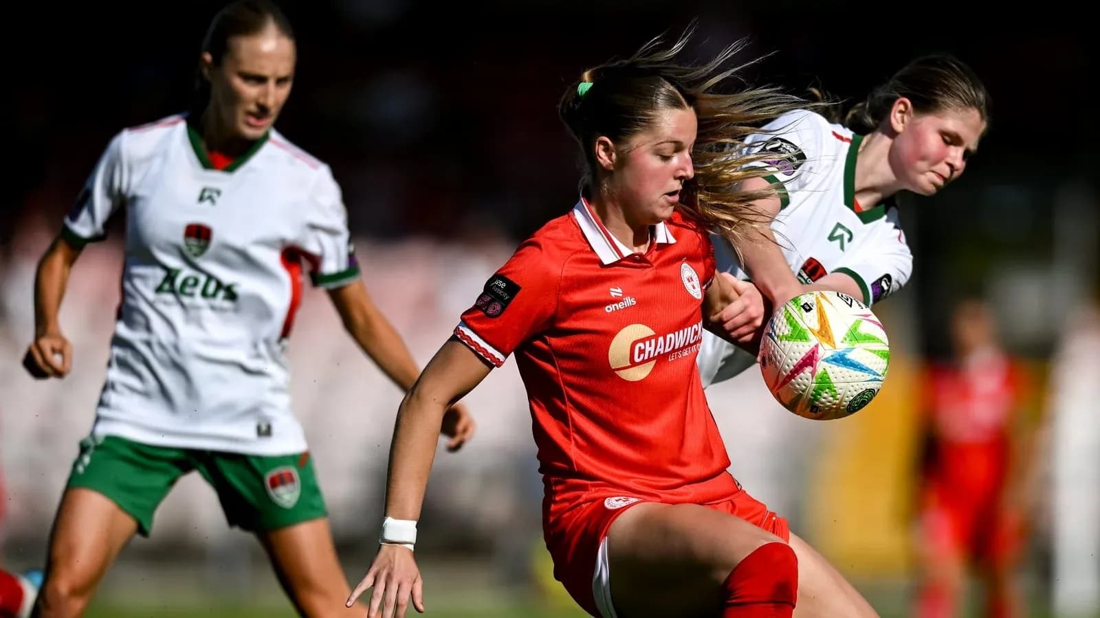 Two players contesting the ball during a match