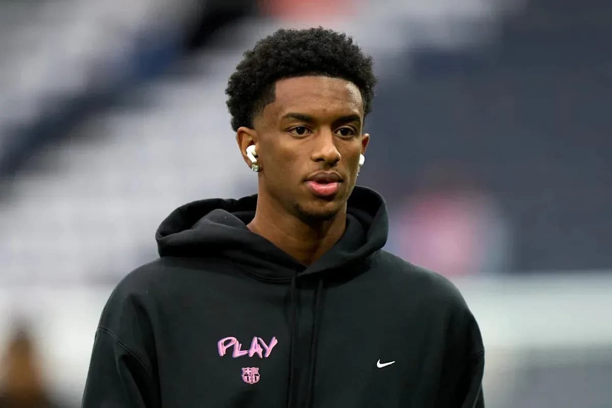 Player wearing hoodie and earbuds before the game