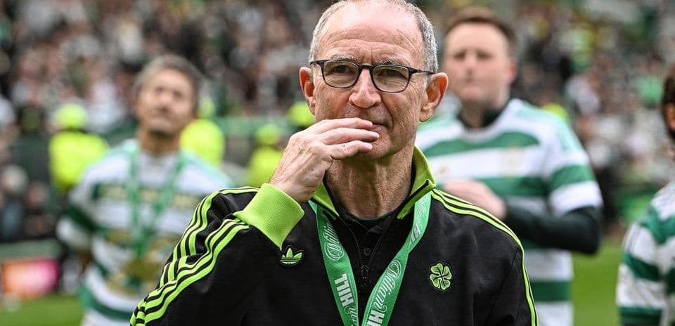 Celtic manager walking on the pitch after match
