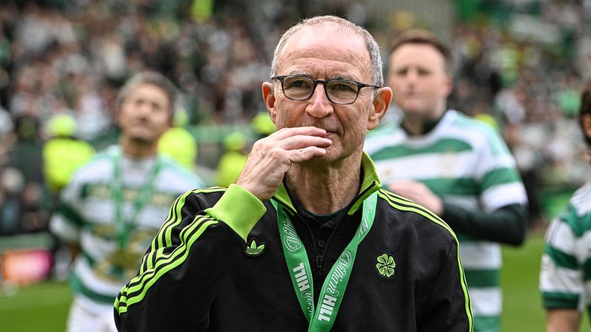 Celtic manager walking on the pitch after match