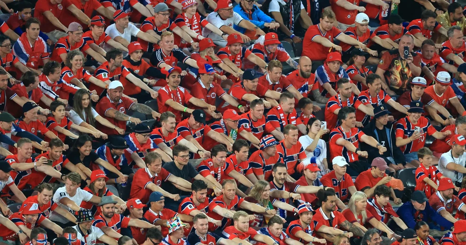 Large crowd of fans wearing red team jerseys
