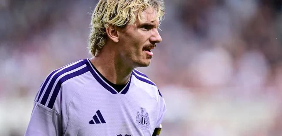 Player wearing Newcastle kit during match
