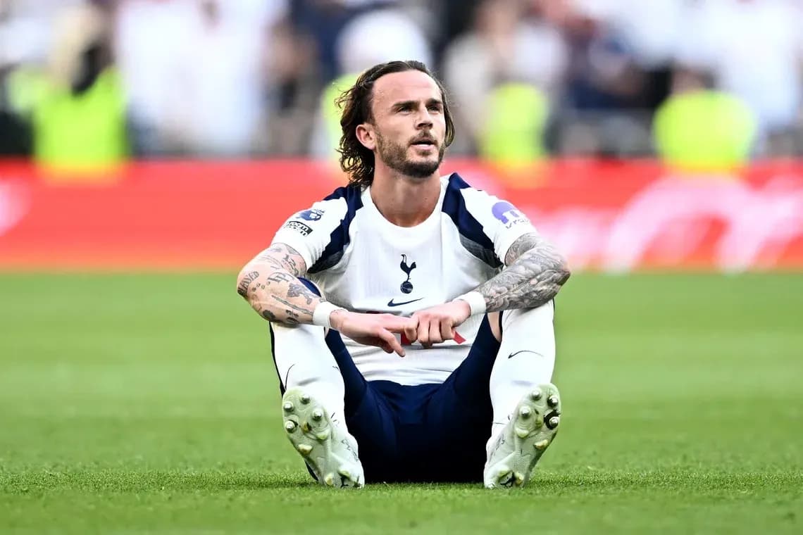 Player sitting on pitch after match conclusion