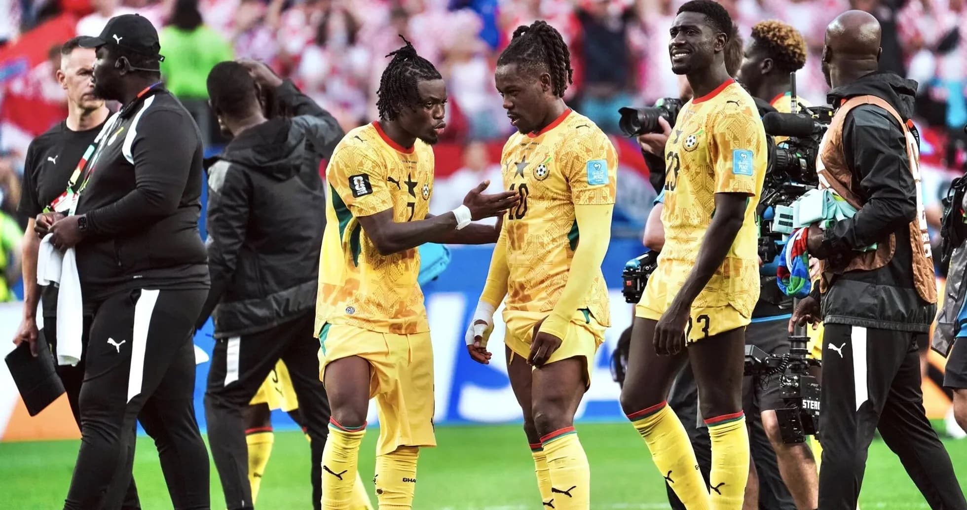 Ghana players discussing during match celebration
