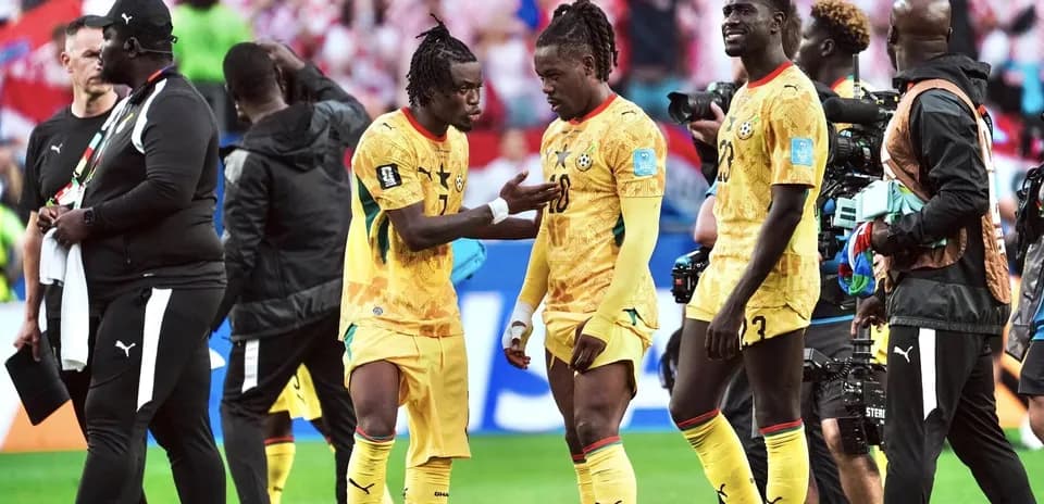 Ghana players discussing during match celebration