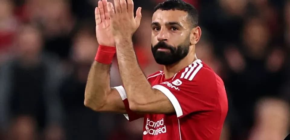 Player applauding fans after match