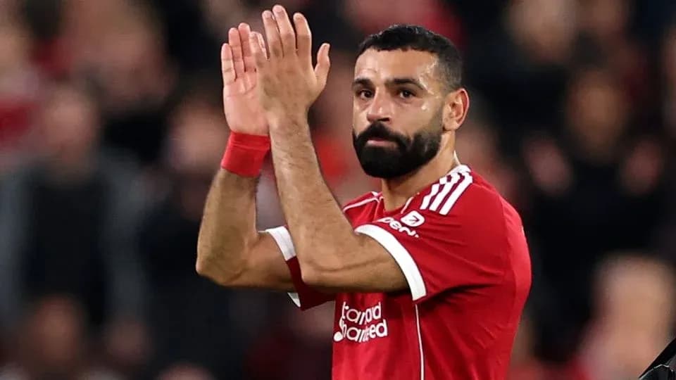 Player applauding fans after match