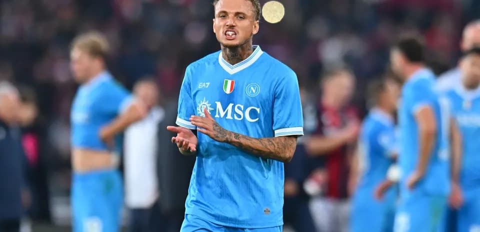Player in blue jersey reacting during football match