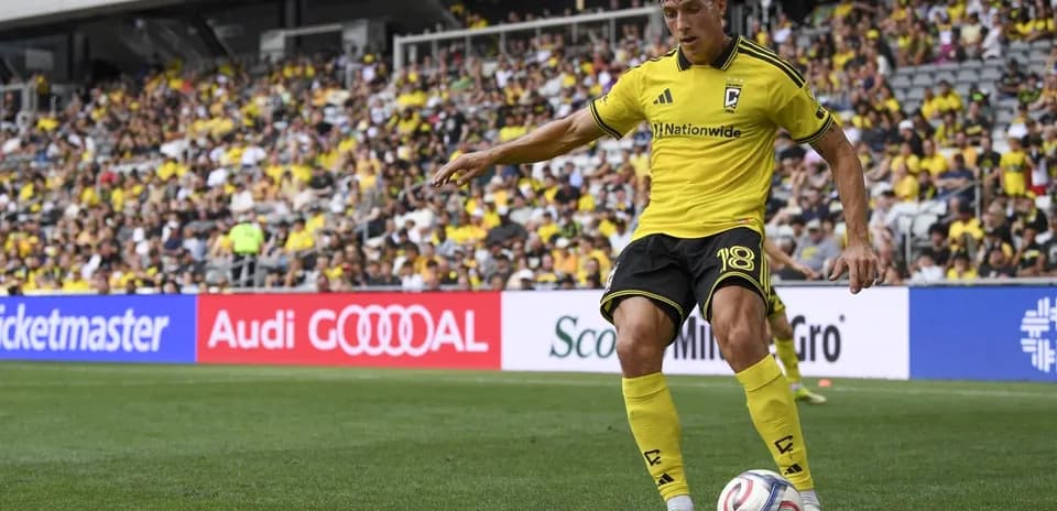 Columbus Crew player taking a corner kick