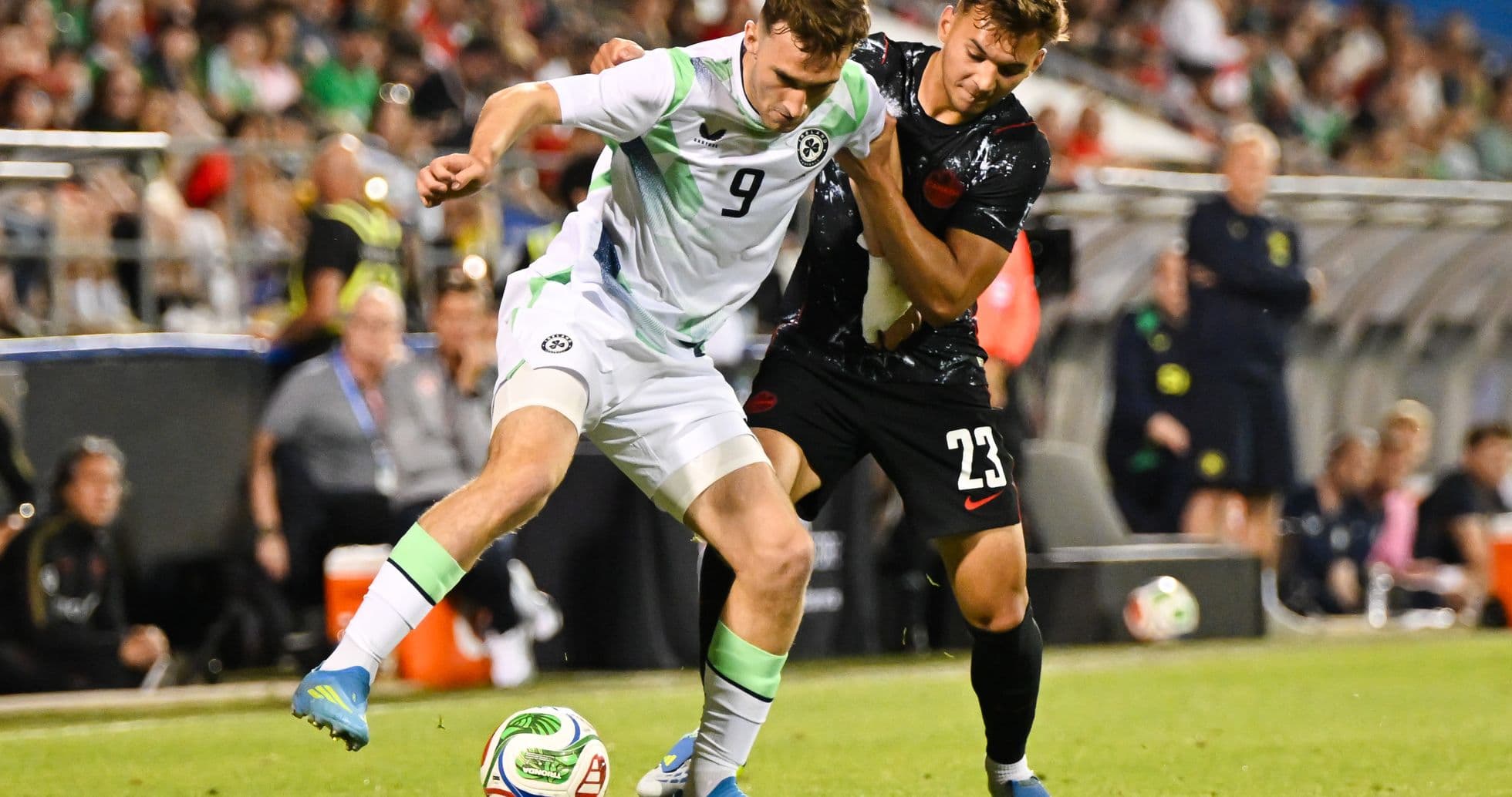 Two players contesting the ball during soccer match