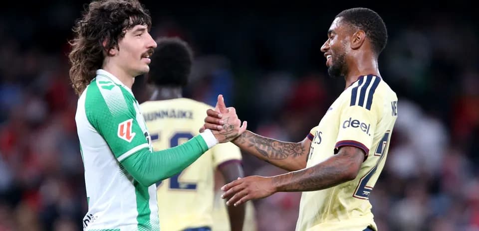 Two players shaking hands after the match