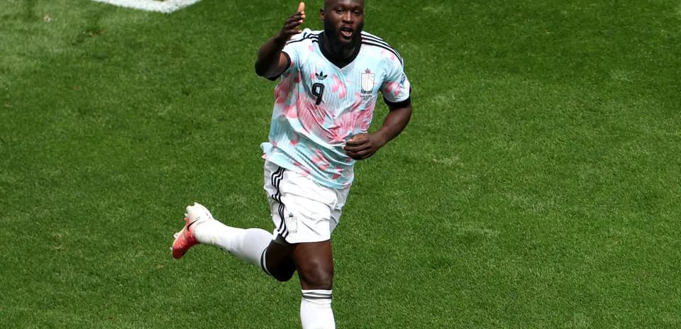 Player celebrating after scoring a goal on pitch