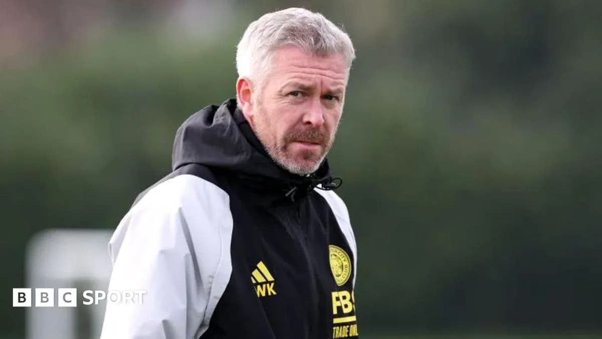 Manager observing training session on the pitch