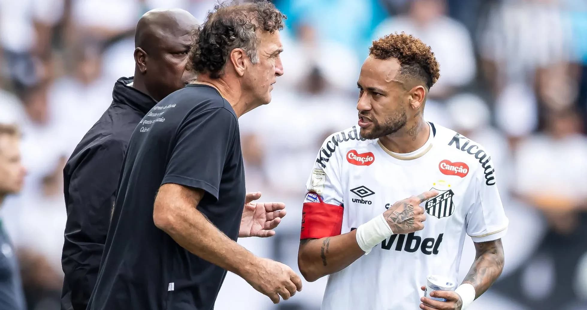 Neymar discussing strategy with coach during match