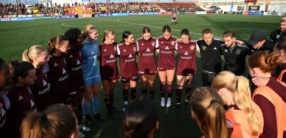 Detroit City players huddled before match