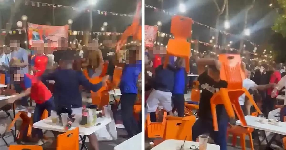 Crowd throwing chairs during a celebration event