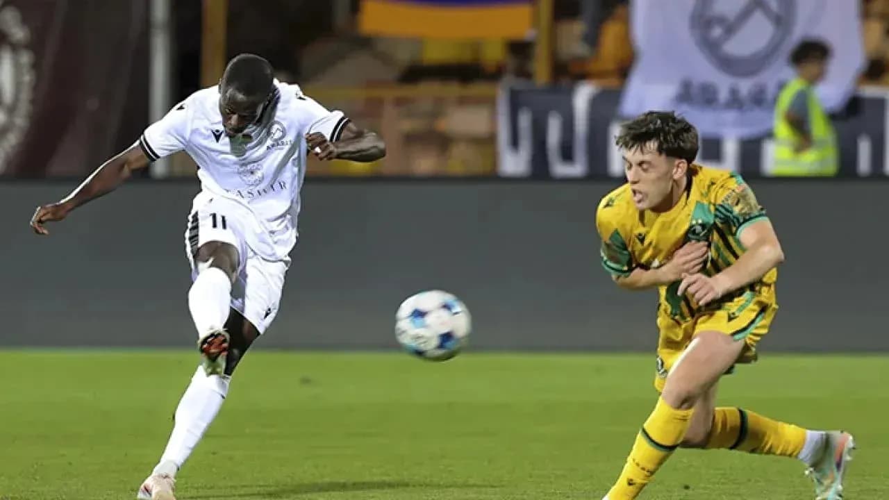 Player shooting the ball during UEFA match