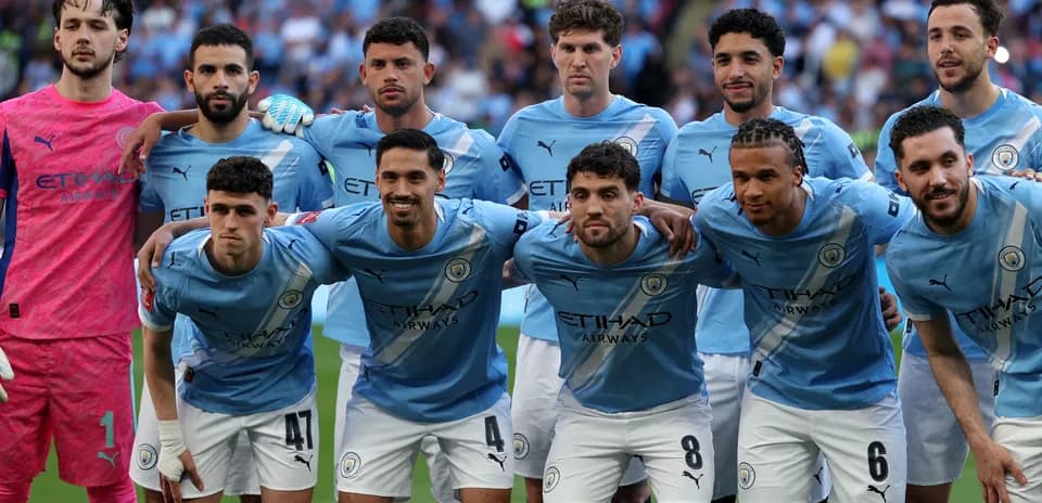Manchester City players posing for team photo
