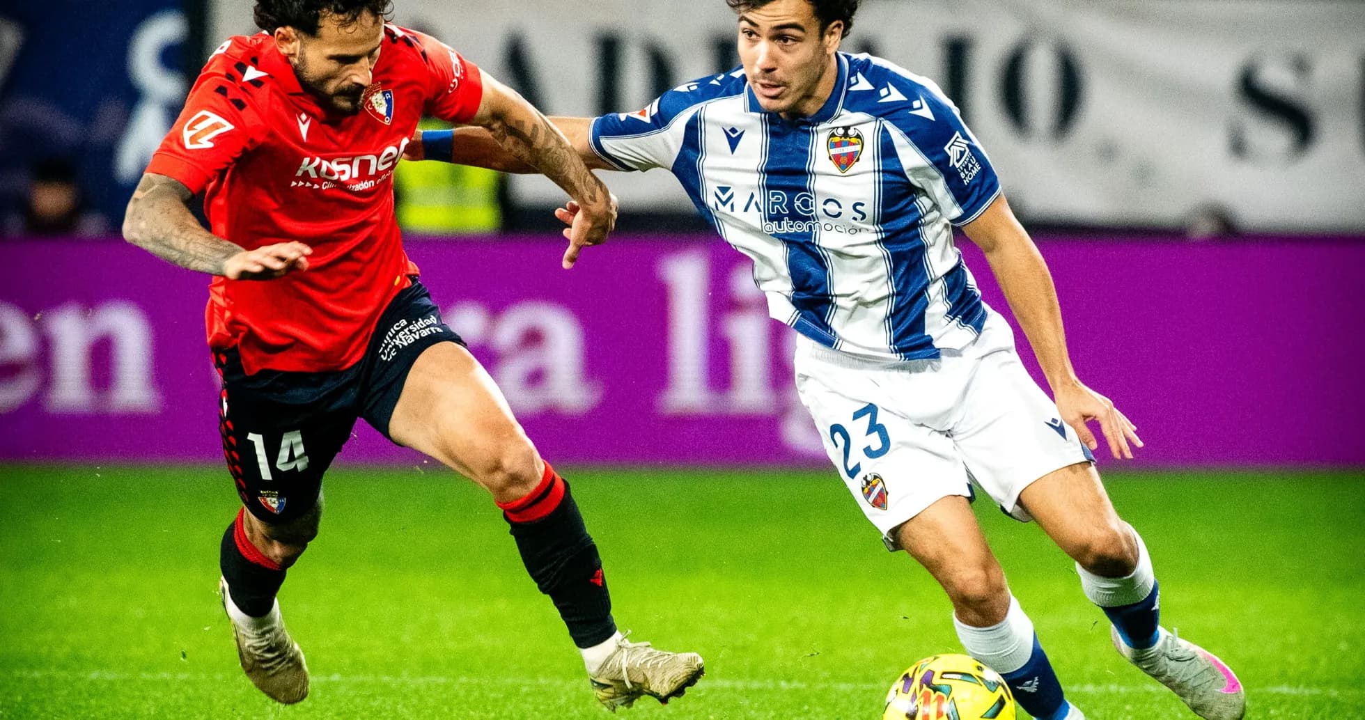 Levante player dribbling past Osasuna defender