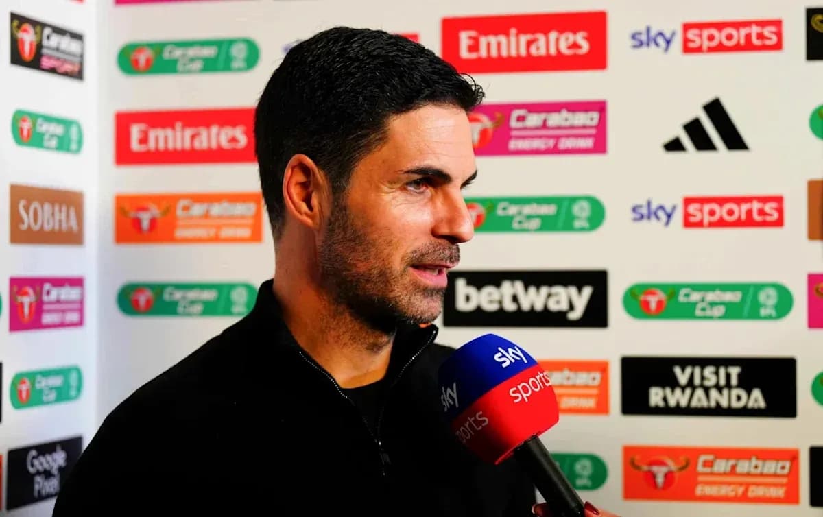 Manager speaking during press conference with microphone