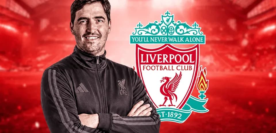 Man in training jacket with Liverpool FC logo