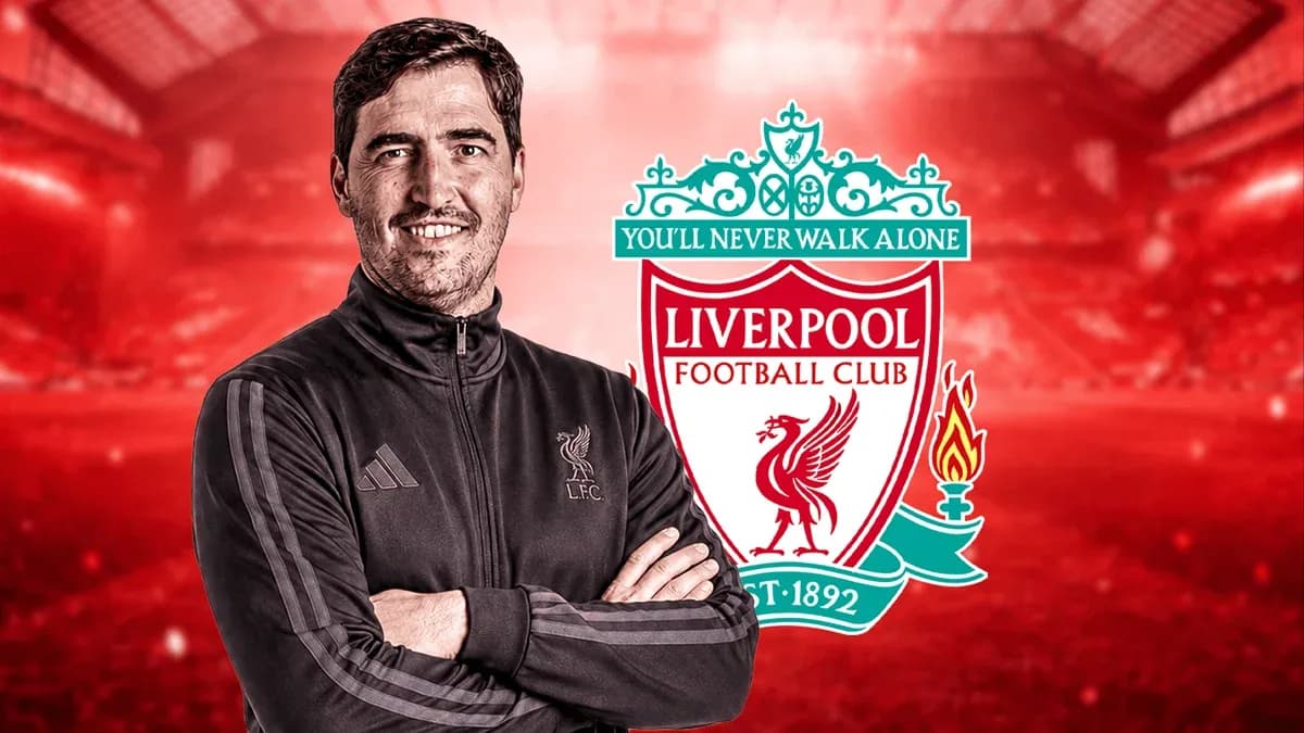Man in training jacket with Liverpool FC logo