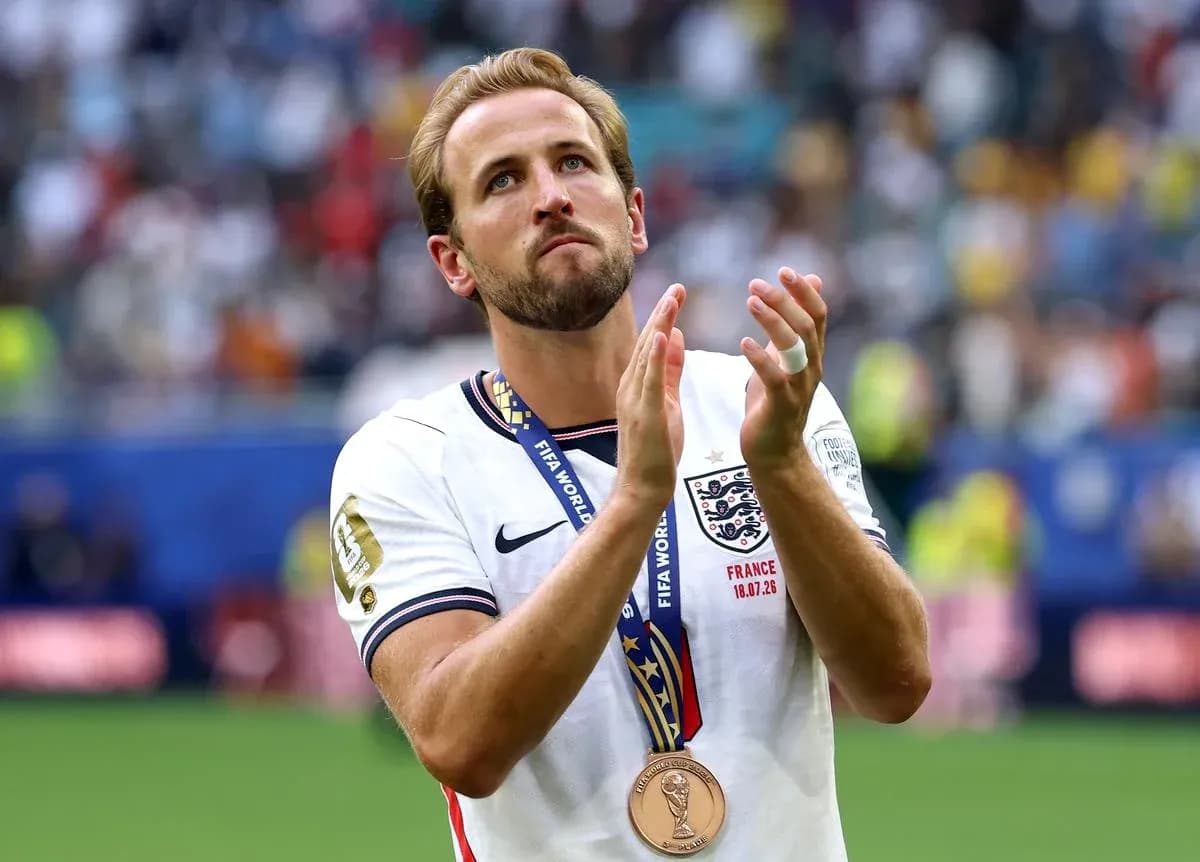 Player applauding while wearing a bronze medal