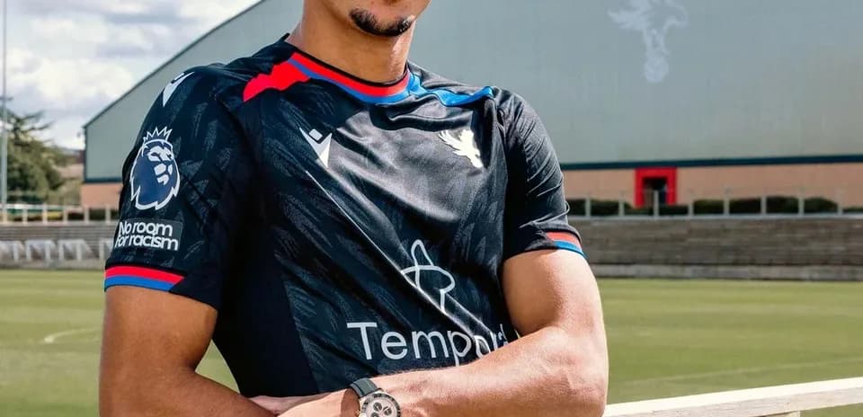 Player posing in Crystal Palace training kit