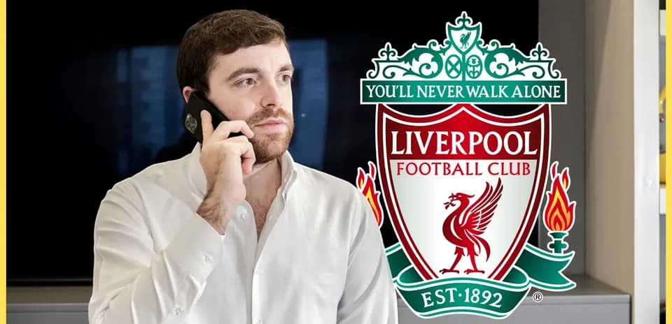 Person talking on phone with Liverpool FC logo
