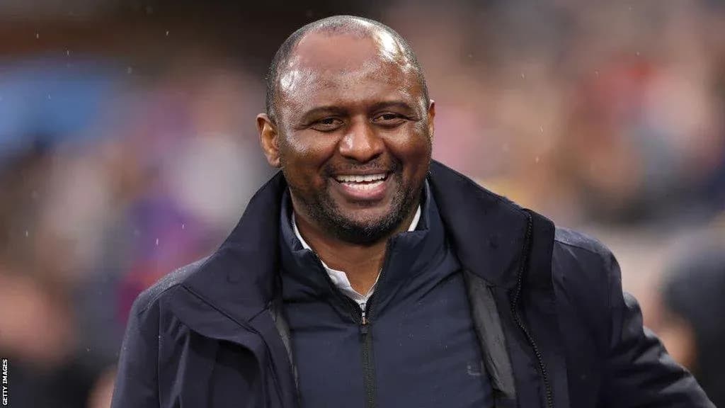 Man smiling during a football match event