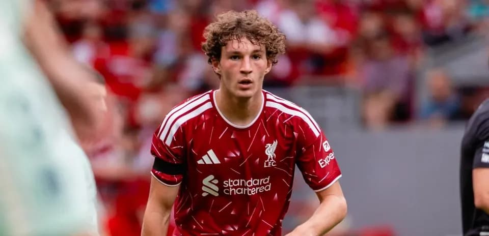 Player in red Liverpool kit during match action