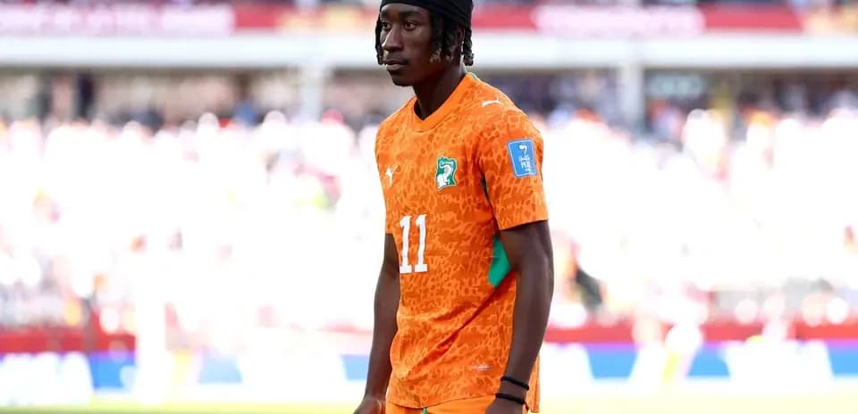 Player wearing orange jersey on the field